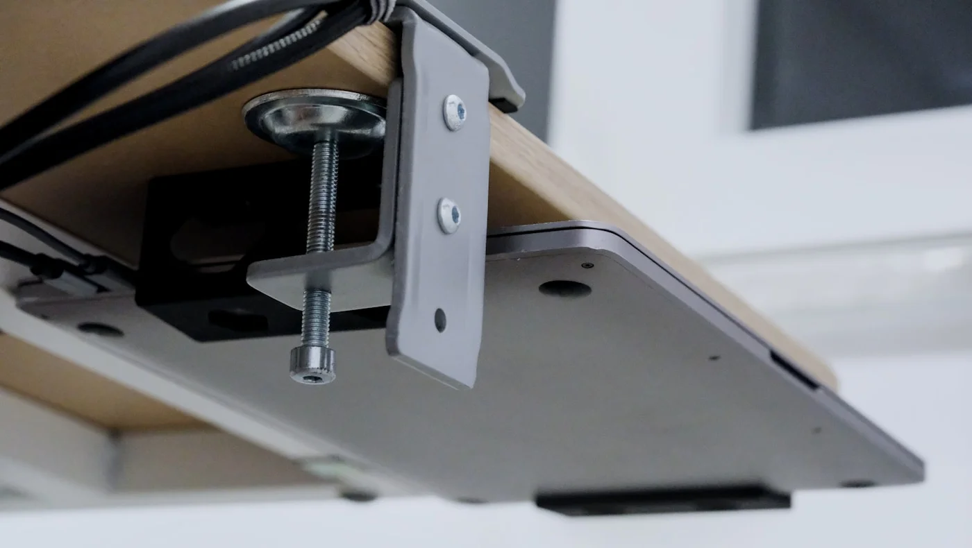 Cable management routing under a wooden desk